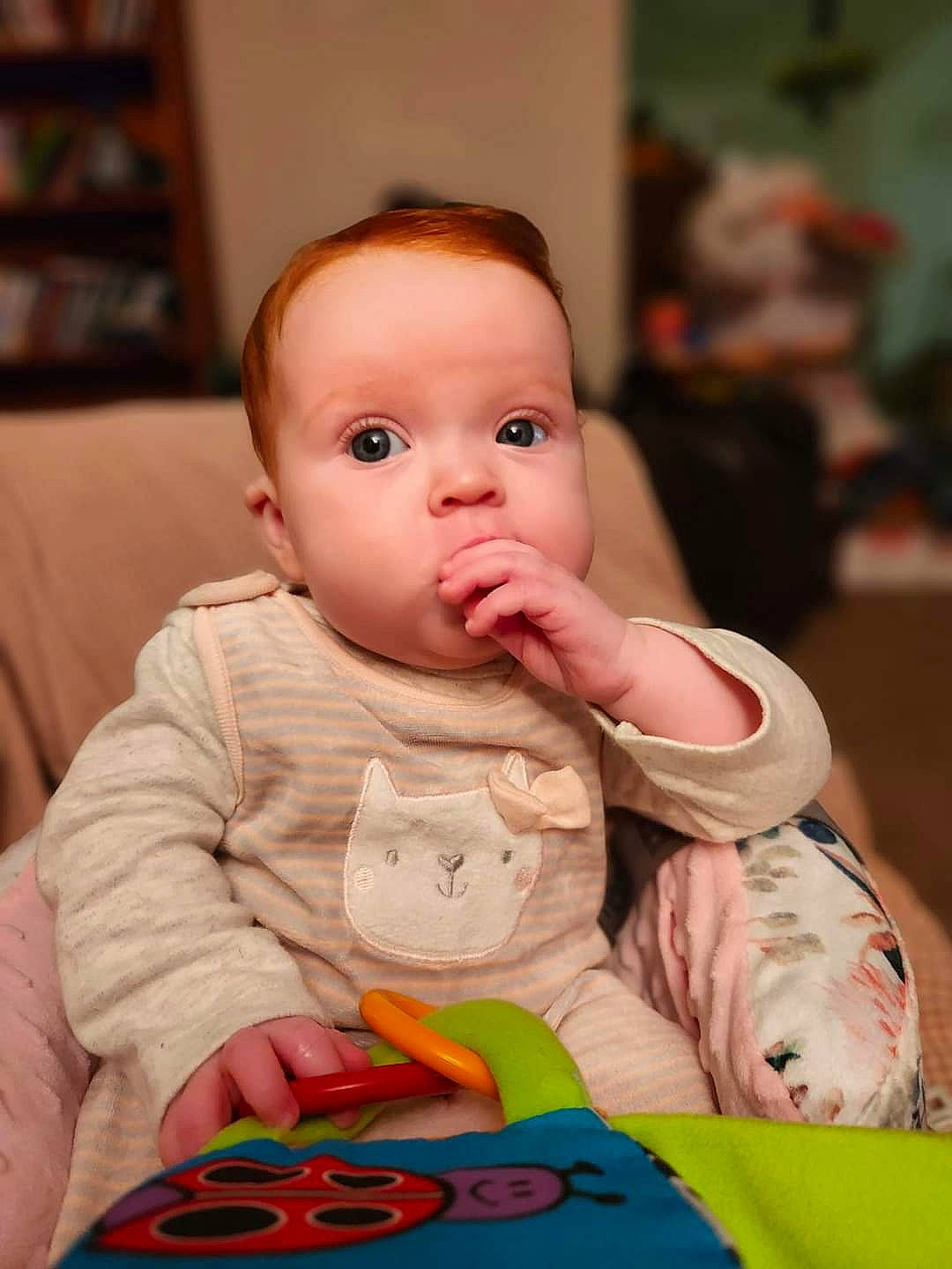 Payton is registered to the contest to win money with this photo: baby, baby_playing_with_toys, baby_toddler_clothing, cheek, child, chin, comfort, flooring, fun, happy, iris, lip, mouth, nose, person, play, room, shelf, sitting, skin