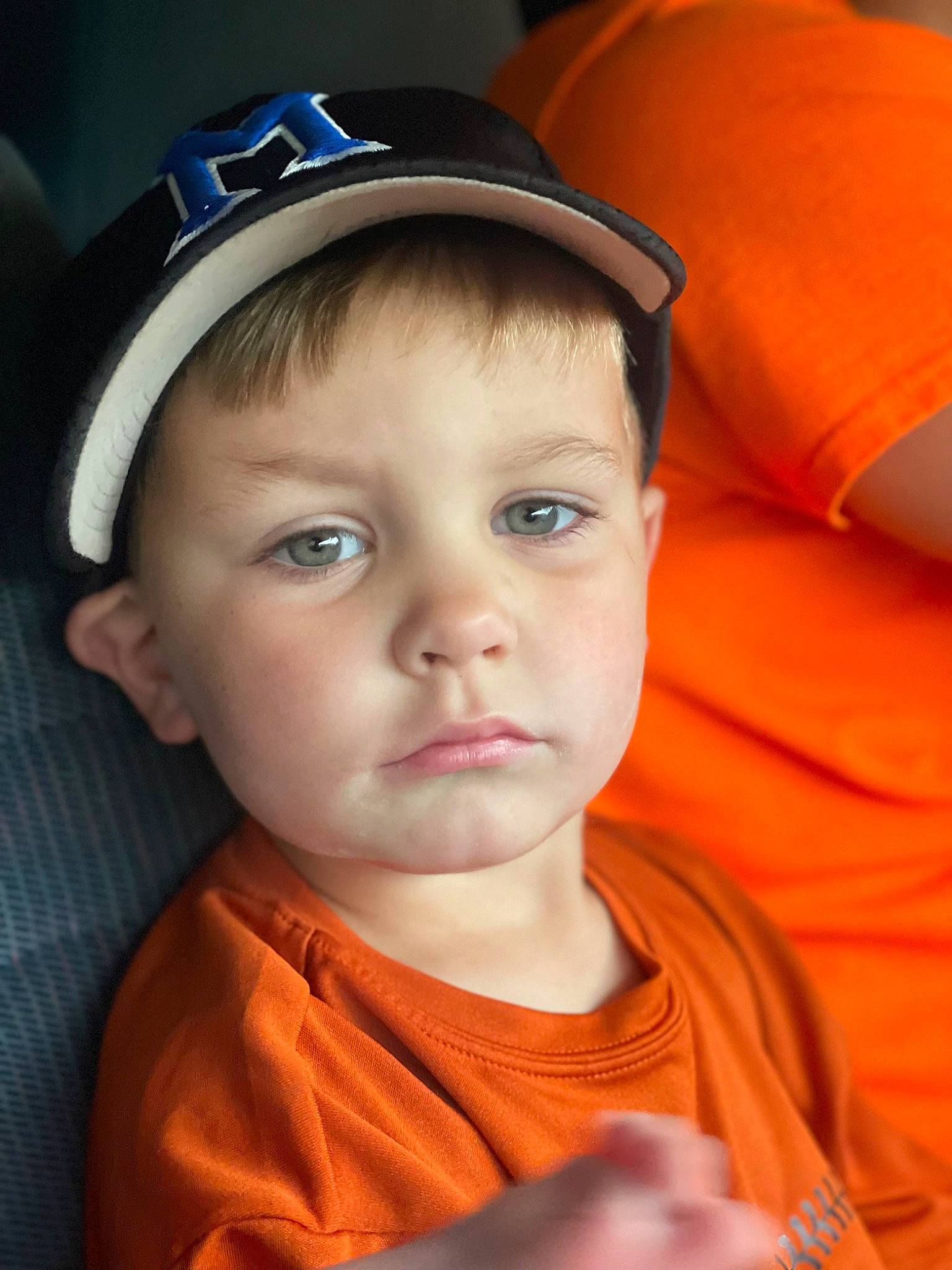 Clarence is registered to the contest to win money with this photo: baby, baseball_cap, cap, cheek, child, chin, close_up, cool, electric_blue, eyebrow, eyelash, flash_photography, fun, hairstyle, happy, helmet, nose, person, personal_protective_equipment, sports_gear