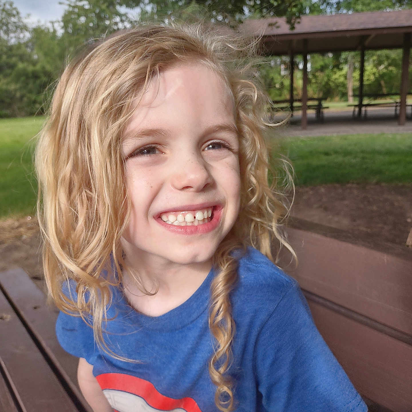 Emrys joined the competition — help win amazing prizes! architecture, bench, blonde, building, child, clothing, face, female, furniture, girl, grass, hair, happy, head, person, photography, plant, portrait, smile, t_shirt