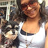 accessory, close_up, collar, crowd, dog, flower_hair, furry, jewelry, necklace, outdoor, person, pet, puppy, selfie, smiling, storefront, sunglasses, tag, tank_top, woman