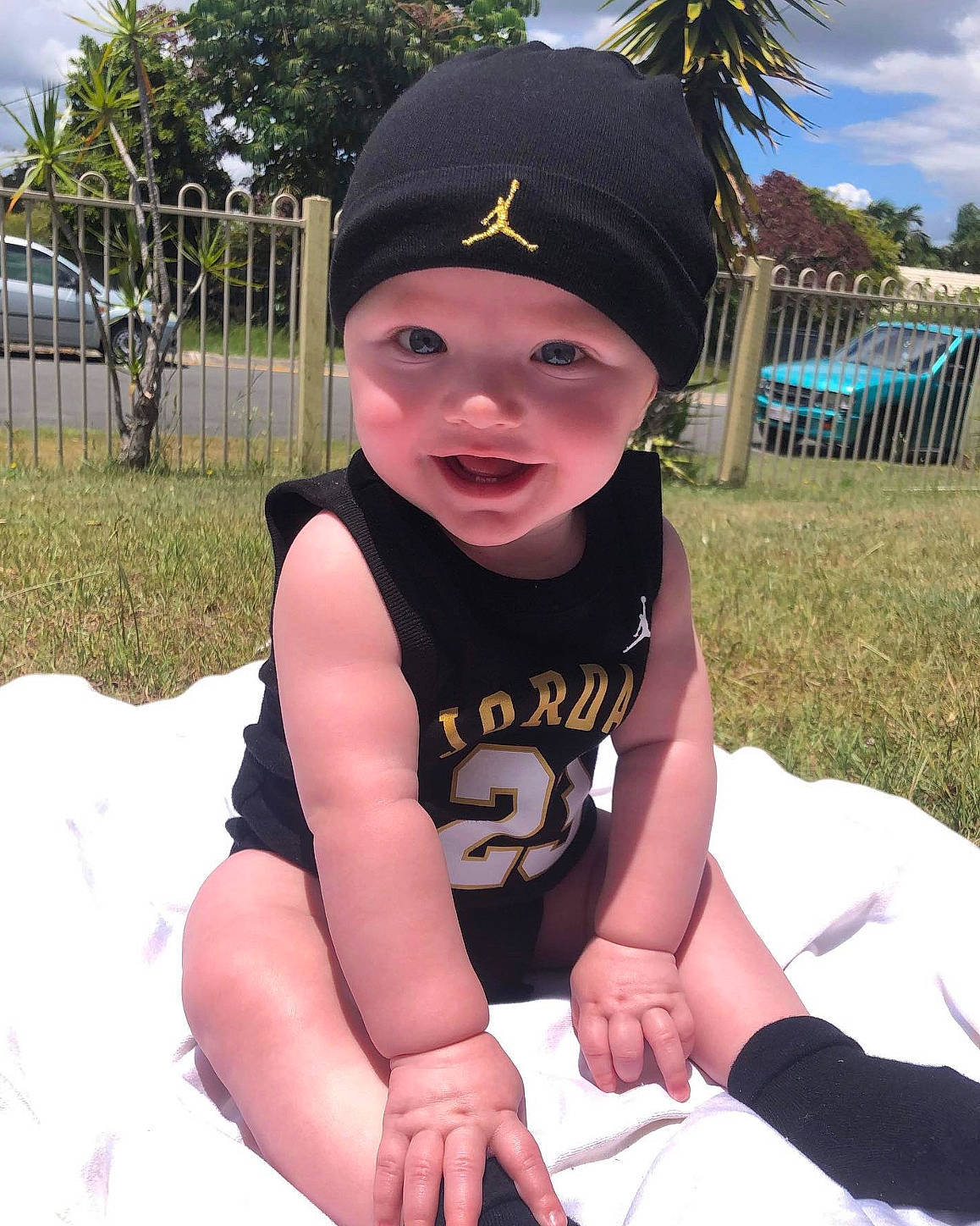 Zyair is registered to the contest to win money with this photo: baby, baby_toddler_clothing, baseball_cap, cap, cloud, cool, fun, grass, happy, hat, headwear, leisure, person, pink, plant, recreation, sky, summer, thigh, toddler