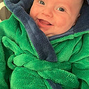 Jaxxon-Brian is registered to the contest to win money with this photo: baby, child, smiling, hood, robe, green, blue, soft, cozy, cute, face, infant, happy, portrait, warm, clothing, toddler, indoor, closeup, expression