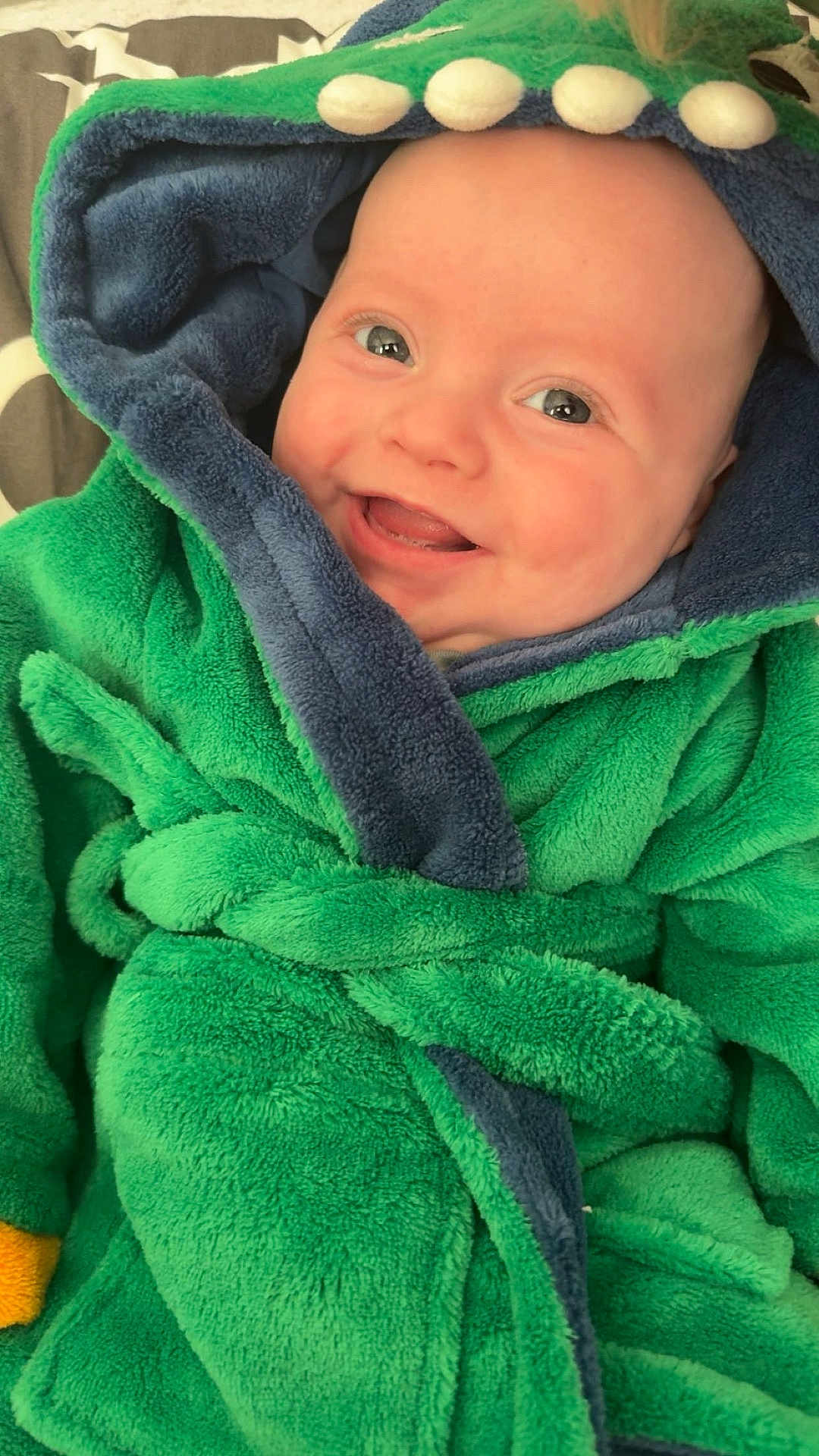 Jaxxon-Brian is registered to the contest to win money with this photo: baby, child, smiling, hood, robe, green, blue, soft, cozy, cute, face, infant, happy, portrait, warm, clothing, toddler, indoor, closeup, expression