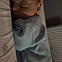 baby, baby_sleeping, bed, blue_clothing, child, closeup, cushion, face, head, indoor, infant, newborn, onesie, peaceful, portrait, quiet, rest, sleeping, soft_light, star_pattern