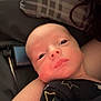 Jaxxon-Brian is registered to the contest to win money with this photo: arm, baby, blanket, candid, closeup, clothing, eyes, face, head, indoors, infant, newborn, person, pillow, portrait, resting, skin, sleepy, soft, stars
