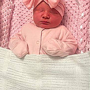 Amelia is registered to the contest to win money with this photo: baby, newborn, sleeping, pink, blanket, hat, bow, cozy, cute, infant, wrapped, soft, child, portrait, clothing, knit, peaceful, indoors, resting, headwear