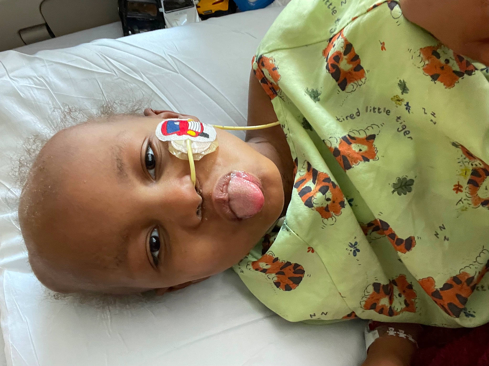 Kenny is registered to the contest to win money with this photo: art, baby, baby_products, baby_toddler_clothing, button, chest, child, craft, fashion_accessory, finger, headgear, linens, neck, pattern, peach, person, product, room, skin, sleeve