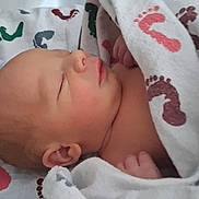 Zayne joined the competition — help win amazing prizes! newborn, baby, sleeping, blanket, hospital, footprints, infant, wrapped, peaceful, soft_light, closeup, skin, face, ear, hand, bed, comfort, quiet, rest, portrait