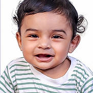 Zian is registered to the contest to win money with this photo: toddler, child, smiling, face, portrait, curly_hair, striped_shirt, happy, baby, person, cute, innocent, young_child, headshot, studio_photo, bright, expression, skin, eyes, mouth