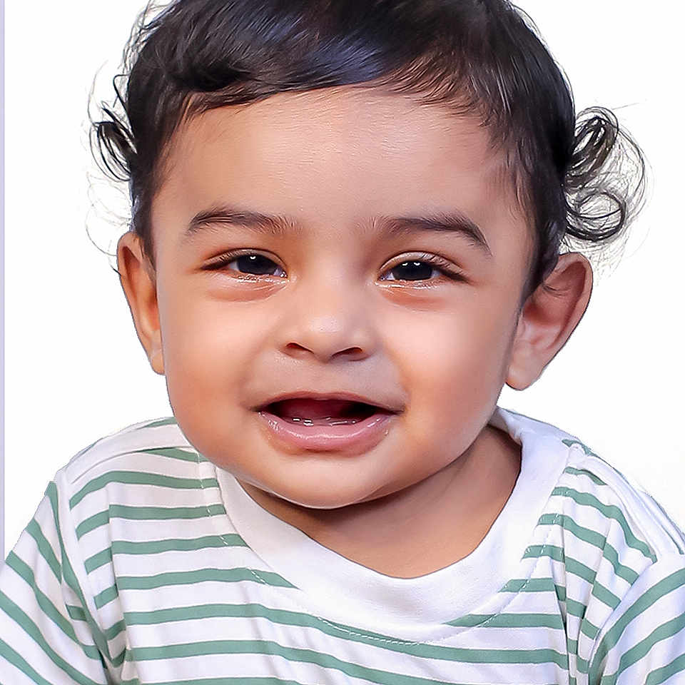 Zian is registered to the contest to win money with this photo: baby, bright, child, curly_hair, cute, expression, eyes, face, happy, headshot, innocent, mouth, person, portrait, skin, smiling, striped_shirt, studio_photo, toddler, young_child