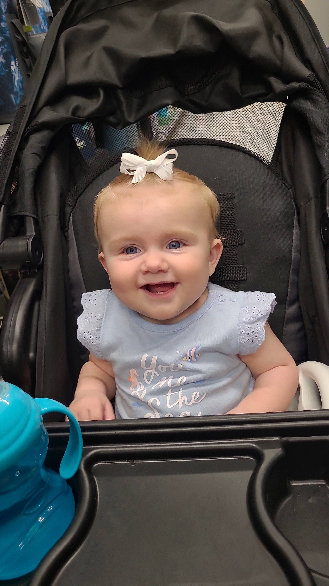 June is registered to the contest to win money with this photo: baby, baby_carriage, baby_products, baby_toddler_clothing, blue, chair, child, fashion_accessory, flash_photography, fun, happy, iris, jewellery, joy, person, sitting, skin, sleeve, smile, tire