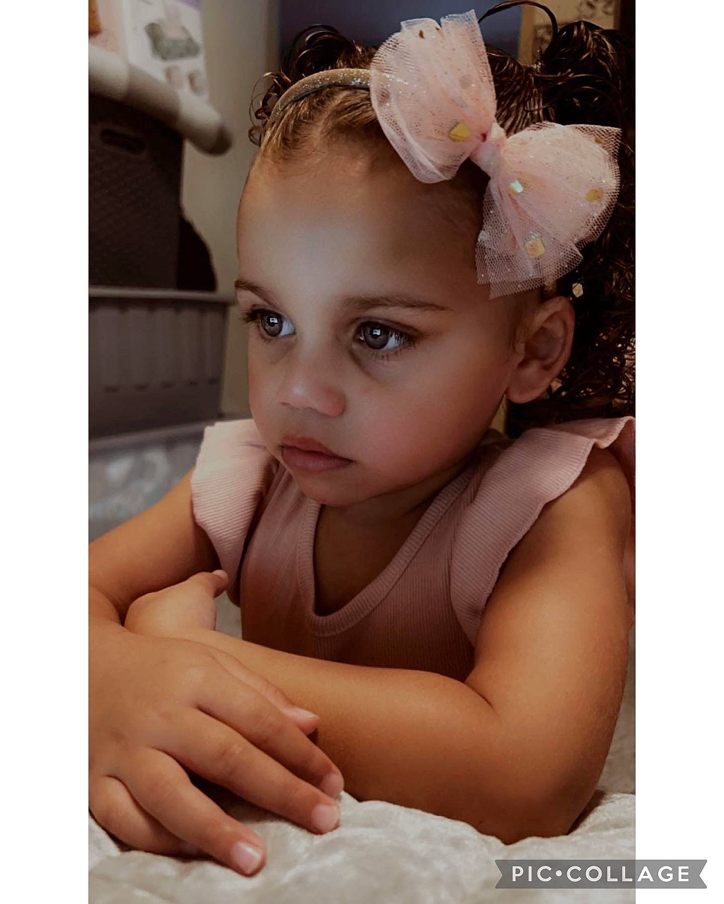 Shauntahlee is registered to the contest to win money with this photo: baby, baby_toddler_clothing, bridal_accessory, child, chin, dress, ear, eye, eyebrow, eyelash, face, fashion_accessory, flash_photography, gesture, happy, headband, headpiece, iris, jewellery, person