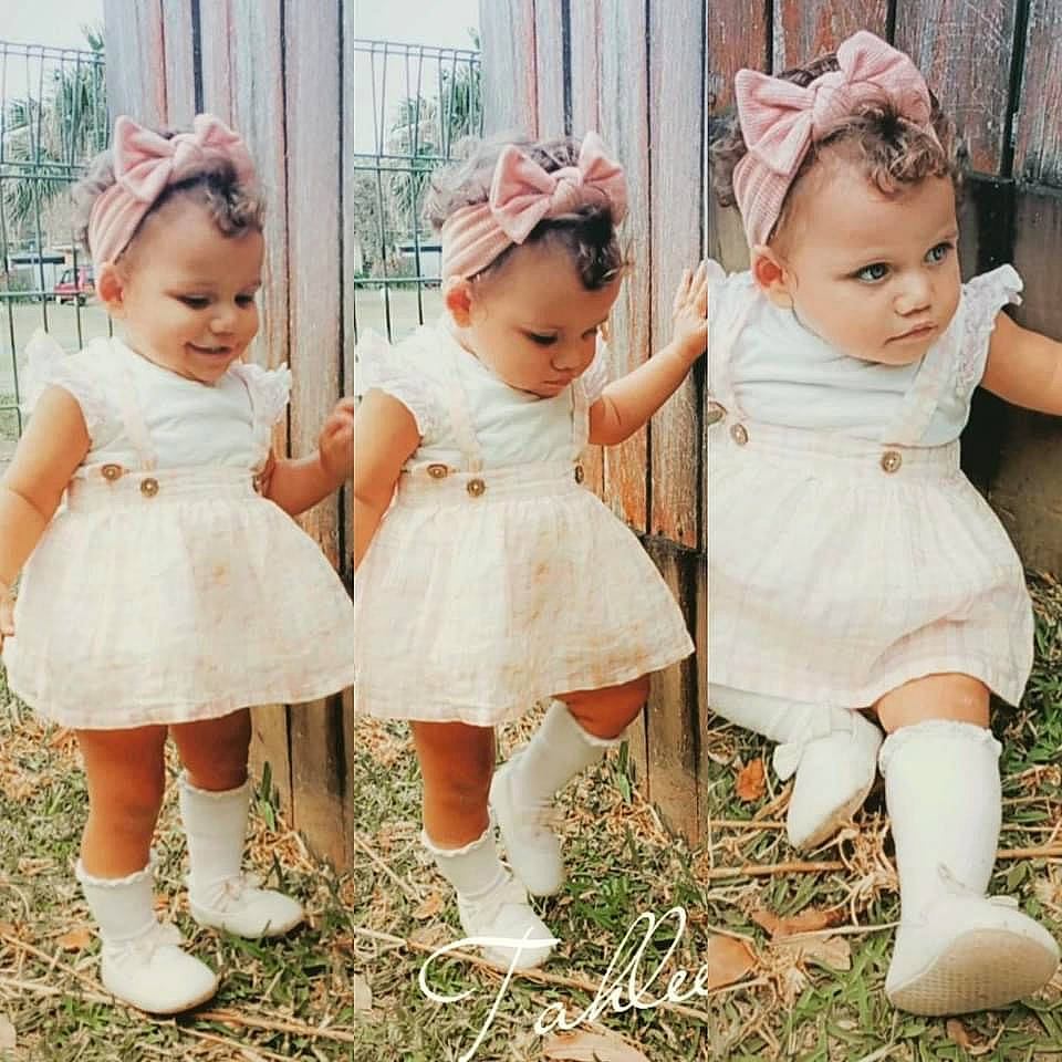 Shauntahlee is registered to the contest to win money with this photo: baby, baby_toddler_clothing, bridal_accessory, bridal_clothing, dress, flash_photography, fun, gesture, grass, happy, headgear, headpiece, interaction, leg, person, pink, plant, skin, standing, toddler
