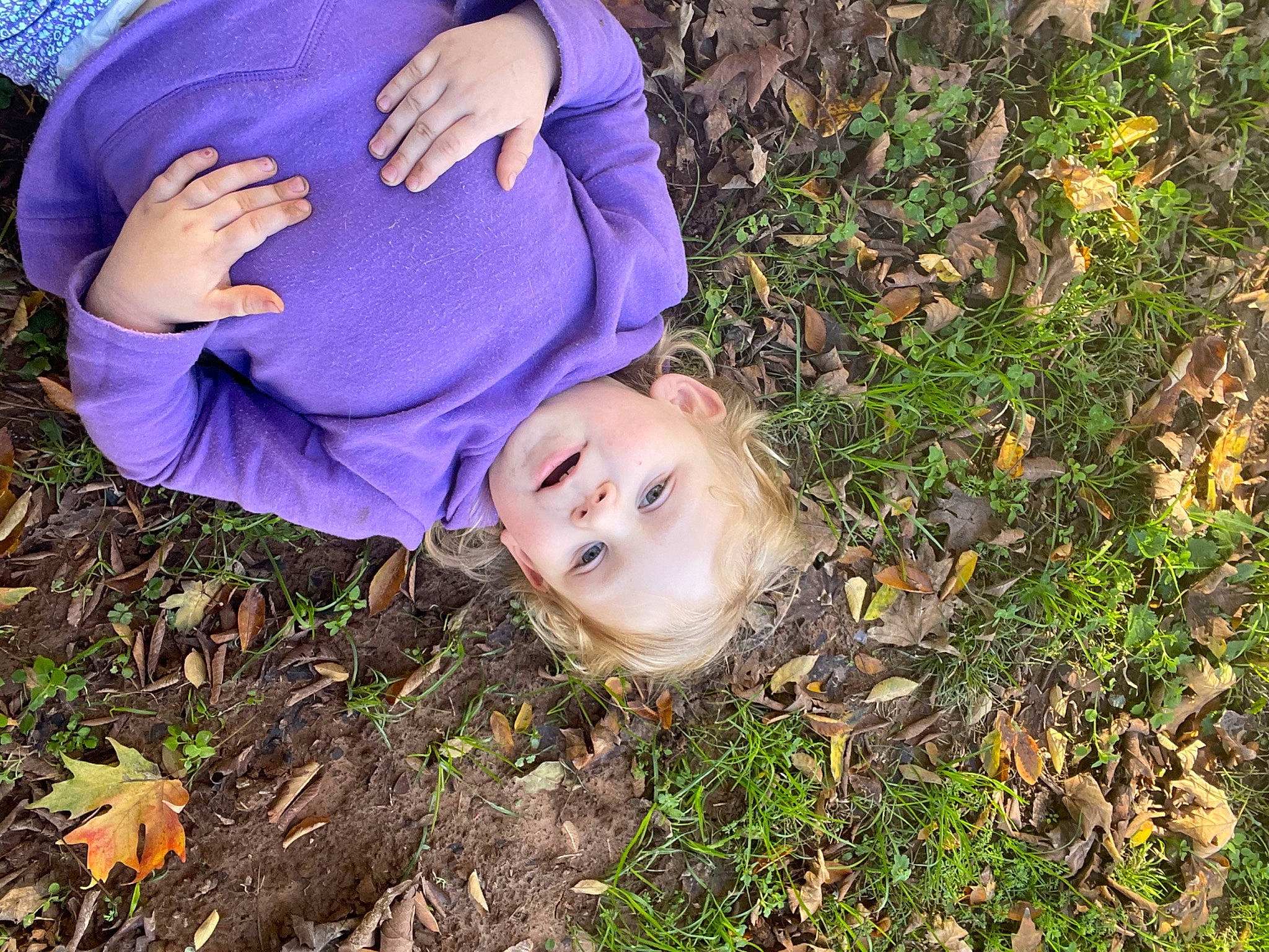 Skyler joined the competition — help win amazing prizes! baby_toddler_clothing, child, electric_blue, face, fun, grass, grass_family, grassland, happy, leaf, natural_landscape, people_in_nature, person, plant, prairie, sitting, smile, soil, toddler, tree