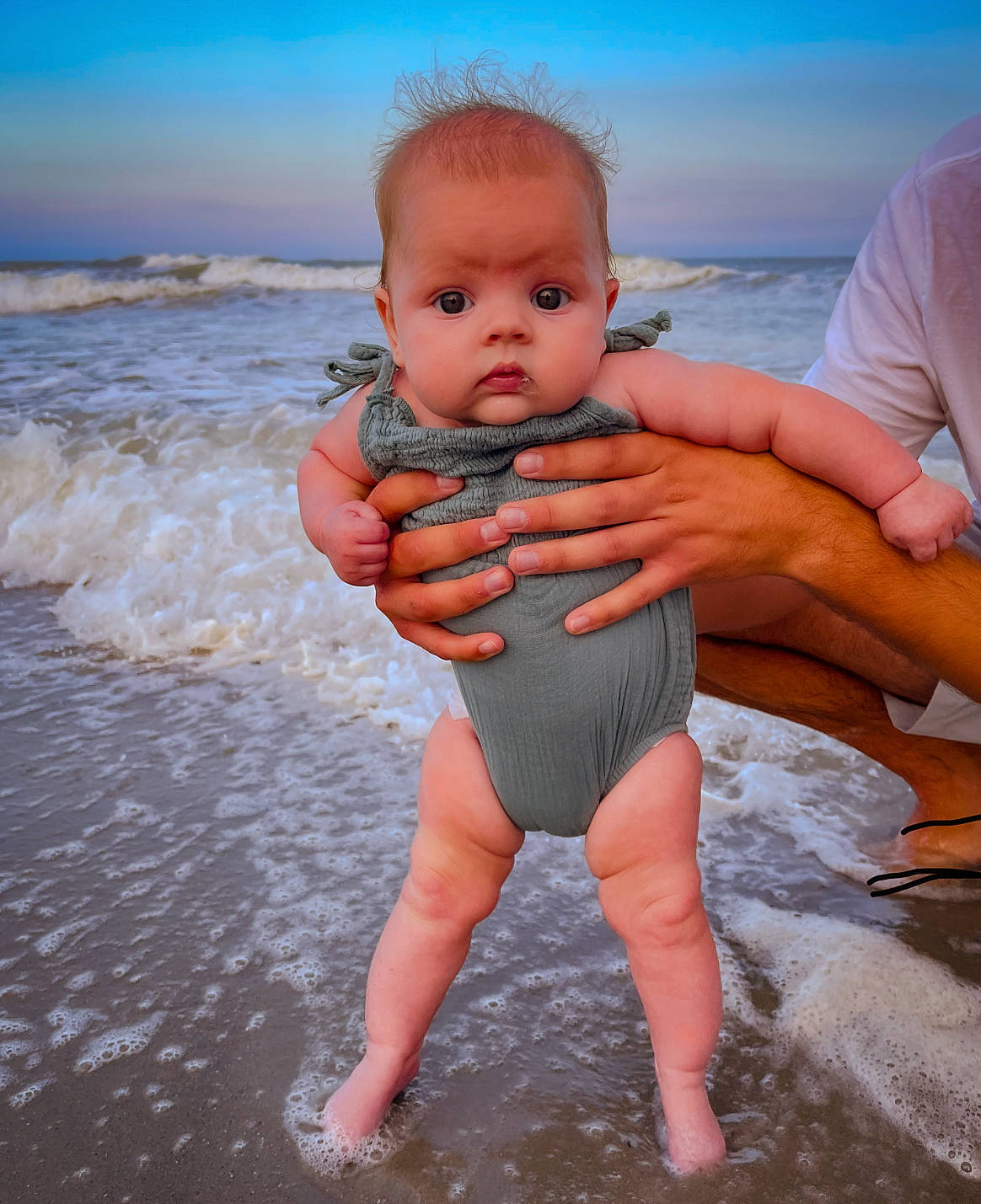 Kori joined the competition — help win amazing prizes! arm, beach, finger, gesture, hand, happy, head, human_body, leisure, people_in_nature, people_on_beach, person, skin, sky, stomach, swimwear, thigh, thumb, toddler, vertebrate