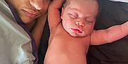 Grayson is registered to the contest to win money with this photo: baby, child, sleeping, diaper, blanket, bed, cuddling, family, indoor, rest, relaxation, person, skin, cute, peaceful, infant, young_child, head, face, nap