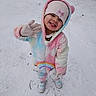 Mila joined the competition — help win amazing prizes! beanie, child, clouds, cold_weather, colorful_onesie, cute, footwear, gloves, happy, outdoor, person, playful, portrait, rainbow, smiling, snow, snowy_ground, standing, winter, winter_clothing
