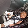 accessories, baby, belt, car, car_interior, carseat, clothing, cushion, face, footwear, glove, head, homedecor, person, photography, portrait, shoe, sneaker, transportation, vehicle