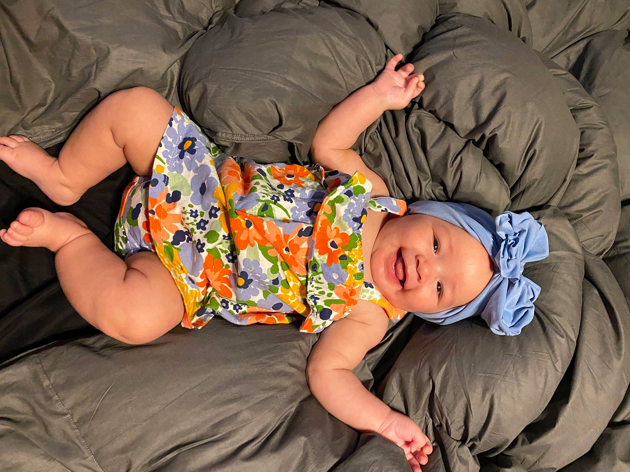 Kamryn joined the competition — help win amazing prizes! arm, baby_toddler_clothing, child, comfort, couch, facial_expression, finger, fun, hairstyle, headwear, human_body, interaction, joint, joy, knee, lap, leg, mouth, person, shorts