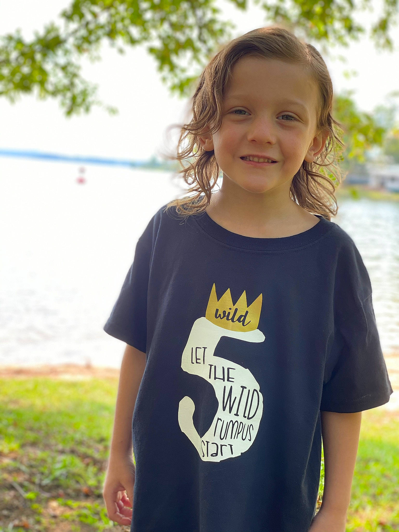 Konner is registered to the contest to win money with this photo: baby_toddler_clothing, child, clothing, cool, facial_expression, grass, happy, joy, neck, pattern, person, photography, play, sleeve, smile, style, summer, t_shirt, toddler, top