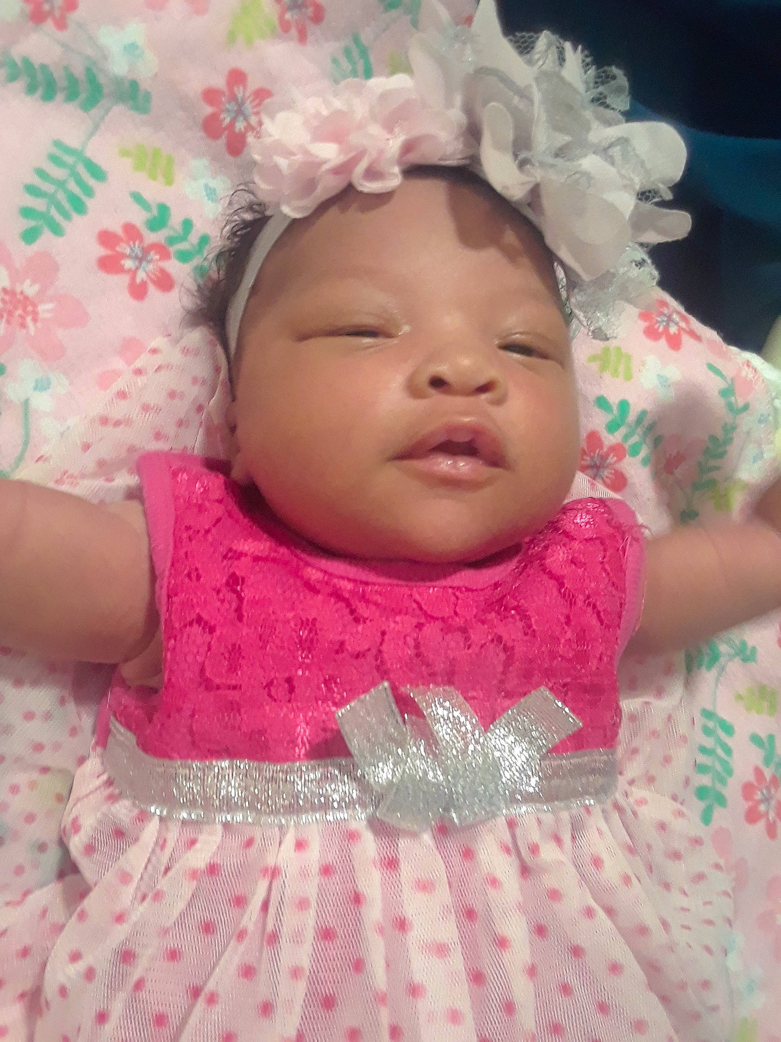 Charliee is registered to the contest to win money with this photo: baby, baby_toddler_clothing, cheek, child, face, fashion_accessory, forehead, hair_accessory, head, headband, headgear, headpiece, pattern, person, pink, skin, smile, textile, toddler