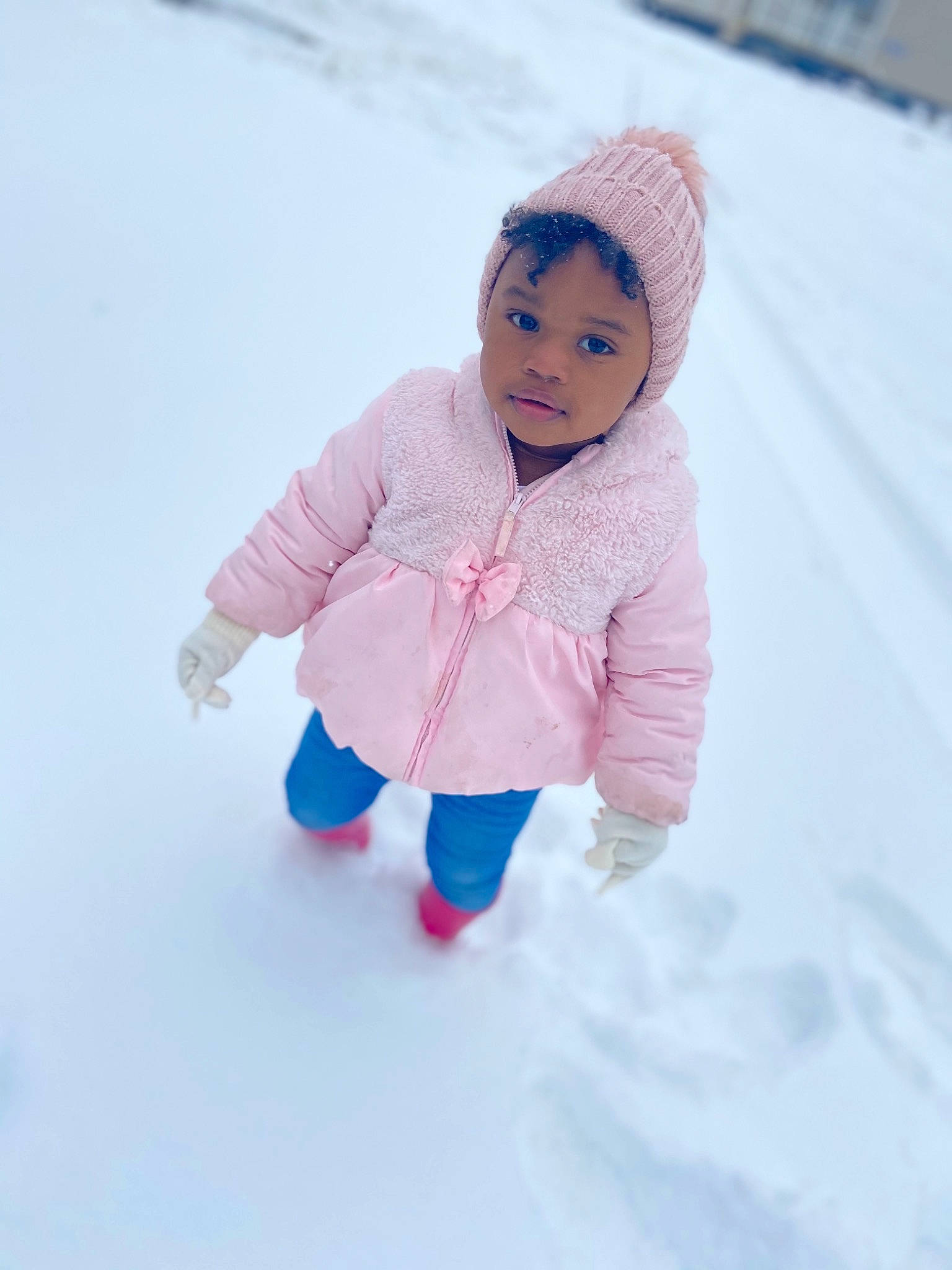 Lauryn is registered to the contest to win money with this photo: baby_toddler_clothing, cap, electric_blue, fashion_accessory, freezing, fun, happy, headwear, hood, jacket, knit_cap, leisure, magenta, pattern, person, play, playing_in_the_snow, recreation, sleeve, snow