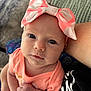 baby, infant, headband, bow, pink, peach, clothing, face, eyes, skin, hand, arm, person, portrait, closeup, indoor, candid, cute, child, newborn