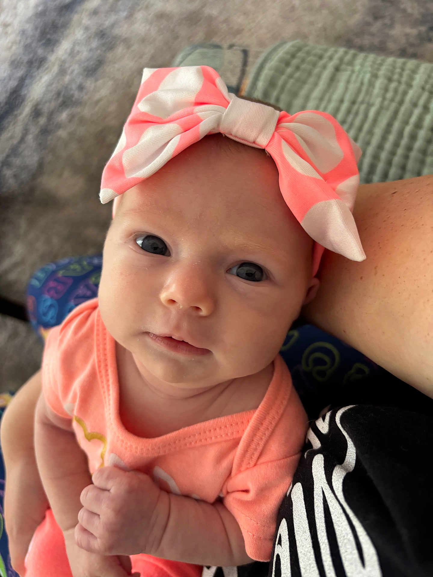 Leona joined the competition — help win amazing prizes! baby, infant, headband, bow, pink, peach, clothing, face, eyes, skin, hand, arm, person, portrait, closeup, indoor, candid, cute, child, newborn