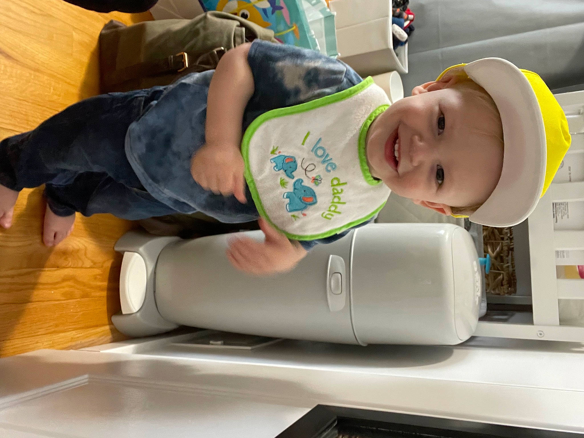 Devin joined the competition — help win amazing prizes! baby, baby_products, baby_safety, baby_toddler_clothing, child, comfort, fun, hat, home_appliance, human_leg, joy, knee, person, personal_protective_equipment, plant_milk, plastic, room, service, sitting, smile