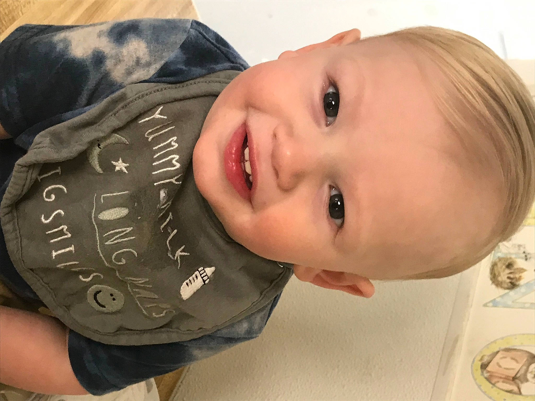 Devin is registered to the contest to win money with this photo: cheek, chin, dress, elbow, eyebrow, eyelash, flash_photography, forehead, happy, lip, mouth, neck, nose, person, plant, skin, smile, toddler, tree, vertebrate