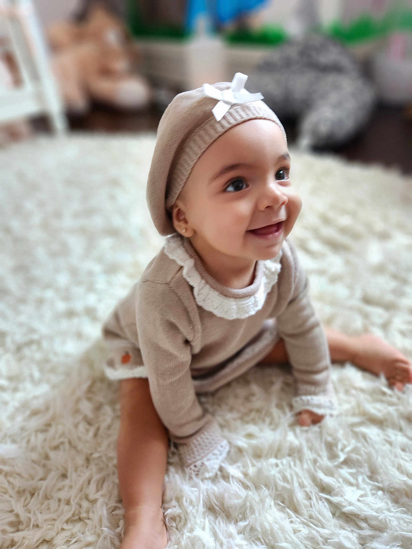Elena joined the competition — help win amazing prizes! baby, child, smile, beret, beige_outfit, sitting, white_rug, soft_texture, indoor, happy, portrait, cute, infant, face, headwear, cozy, warm, young_child, home, fashion