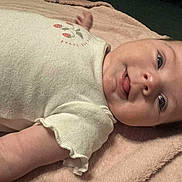 Haisley joined the competition — help win amazing prizes! baby, infant, face, tongue, clothing, onesie, blanket, lying_down, cute, child, soft_texture, pink, cream_color, playful, skin, head, arm, sleepwear, young_child, portrait