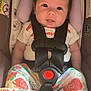 Kamila joined the competition — help win amazing prizes! baby, child, car_seat, safety_harness, green_bow, floral_pants, polka_dot_shirt, infant, cute, smiling, indoors, seatbelt, happy, person, portrait, head_support, small_child, colorful_clothing, toddler, closeup