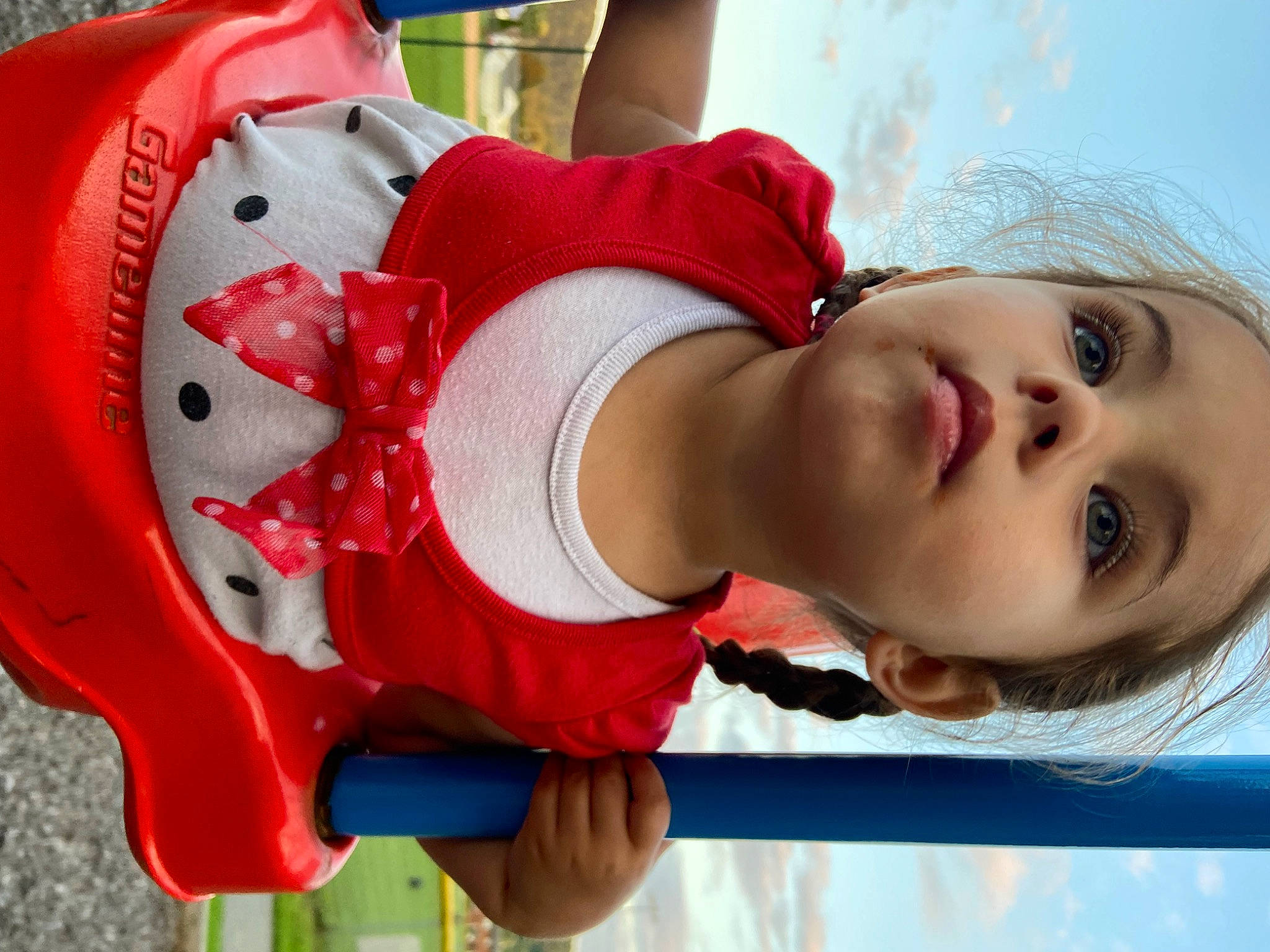 Sara is registered to the contest to win money with this photo: arm, child, clothing, event, eye, eyelash, face, happy, head, headgear, human_body, leisure, mouth, organ, person, pink, recreation, red, skin, toddler