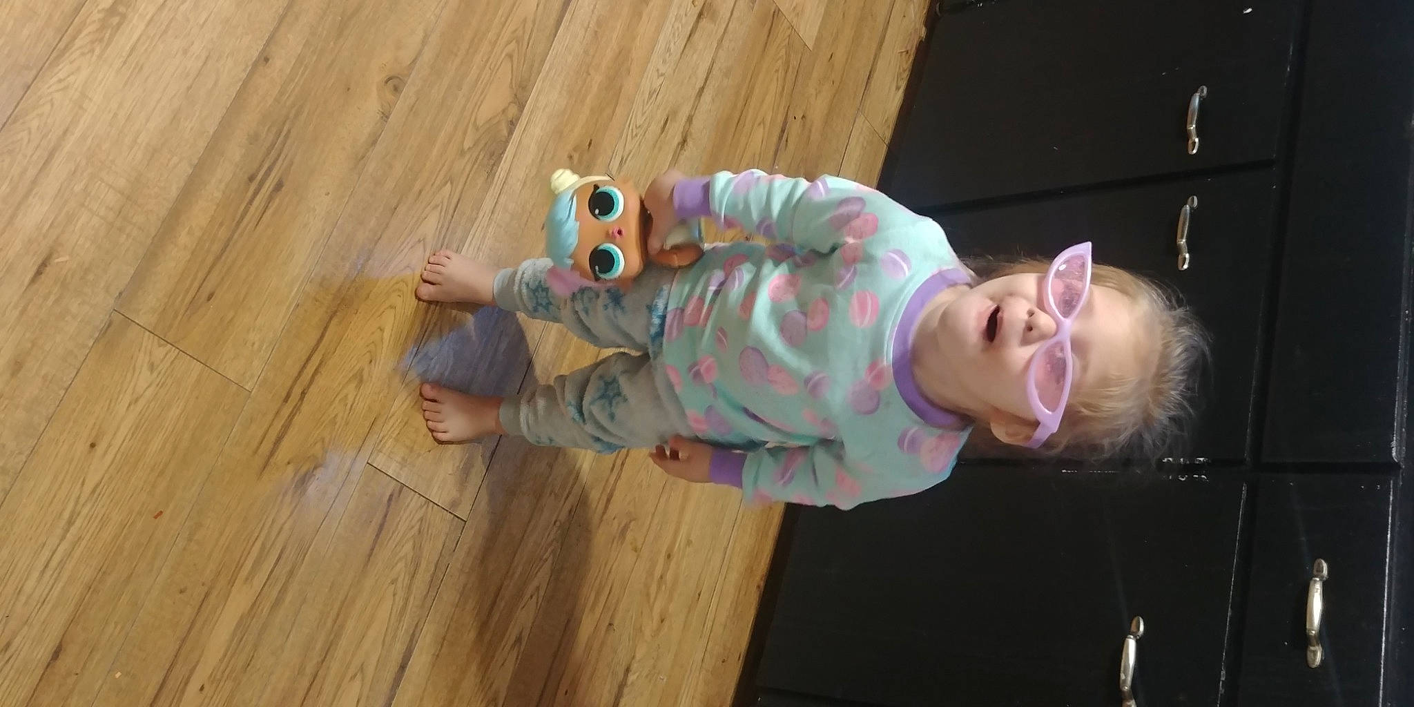 Tatiana is registered to the contest to win money with this photo: baby, baby_toddler_clothing, child, floor, flooring, fun, hardwood, hat, laminate_flooring, pattern, person, plank, plywood, room, sitting, smile, toddler, varnish, wood, wood_flooring