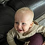 Thomas joined the competition — help win amazing prizes! toddler, child, smiling, blonde_hair, blue_eyes, hoodie, indoor, couch, leather, furniture, carpet, jacket, cardboard_box, person, happy, closeup, portrait, casual, home, cute