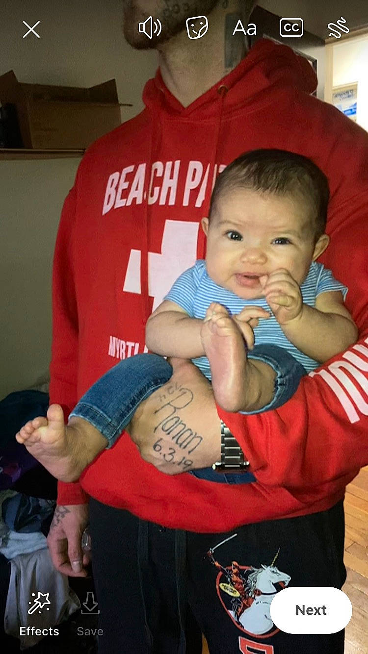 Leilani is registered to the contest to win money with this photo: baby, baby_toddler_clothing, cool, elbow, facial_expression, finger, hairstyle, hand, happy, joint, mouth, muscle, person, shorts, shoulder, skin, sleeve, smile, t_shirt, thigh