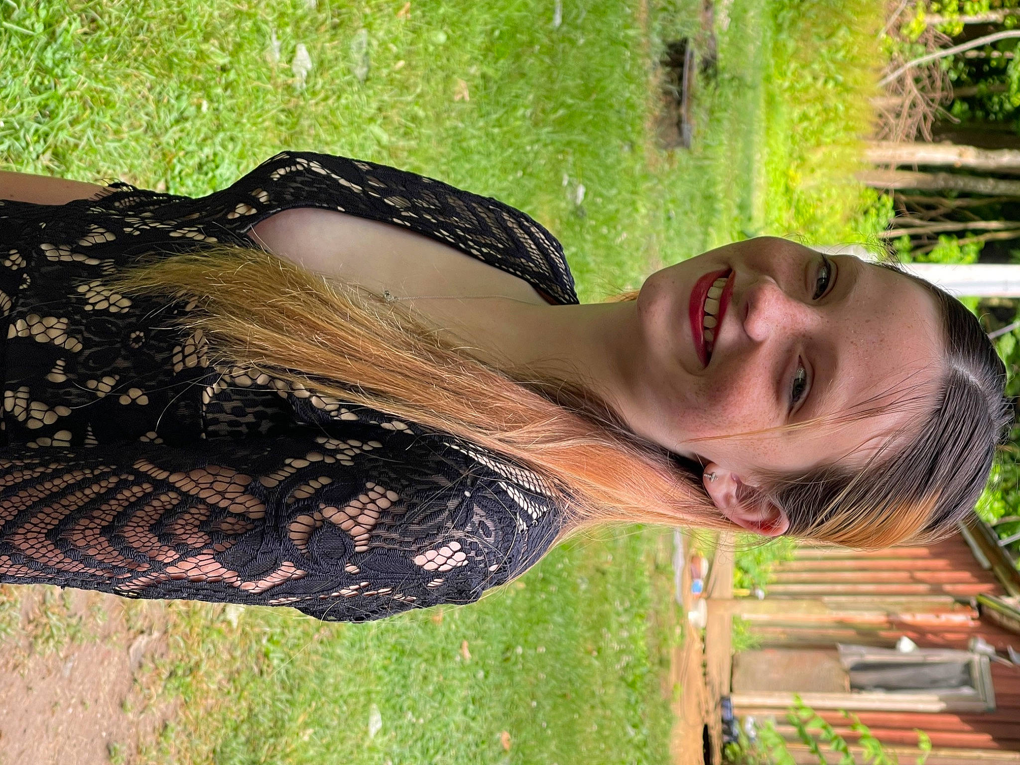 Danielle is registered to the contest to win money with this photo: dress, eyewear, fashion_accessory, fun, grass, happy, human_leg, joy, landscape, leisure, long_hair, neck, people_in_nature, person, plant, shoulder, smile, sunglasses, tree, trunk