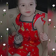 Alicia joined the competition — help win amazing prizes! child, toddler, red_dress, cartoon_prints, chair, beverage, straw, white_roses, floral_overlay, portrait, cute, smiling, indoor, young_child, sitting, drink, person, fashion, happy, face