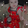 child, toddler, red_dress, cartoon_prints, chair, beverage, straw, white_roses, floral_overlay, portrait, cute, smiling, indoor, young_child, sitting, drink, person, fashion, happy, face