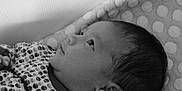 Mia participe au concours pour gagner de l'argent avec cette photo : baby, black_and_white, blanket, child, close_up, clothing, cute, face, hair, head, indoors, infant, newborn, peaceful, polka_dot, portrait, resting, sleeping, soft_light, young