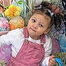 Leriah is registered to the contest to win money with this photo: child, girl, pink_pinafore, white_shirt, blue_bag, flowers, easter_eggs, mural, hair_bows, curly_hair, playful, portrait, indoors, colorful, decor, cute, young_child, smiling, standing, holiday_theme