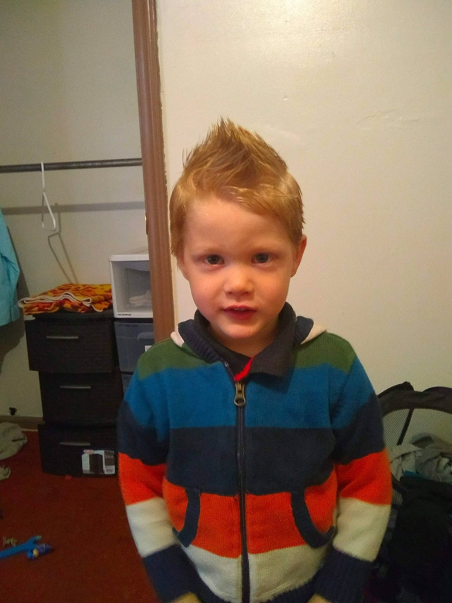 Cassius joined the competition — help win amazing prizes! arm, cheek, child, face, head, outerwear, person, smile, standing, t_shirt, toddler