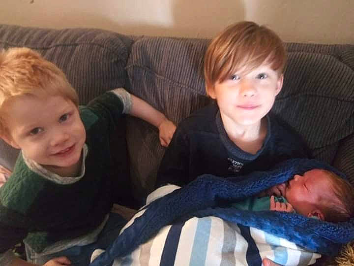 Draiden is registered to the contest to win money with this photo: baby, cheek, child, comfort, eye, face, facial_expression, family, fun, head, lap, laugh, leg, people, person, photography, sibling, sitting, smile, toddler