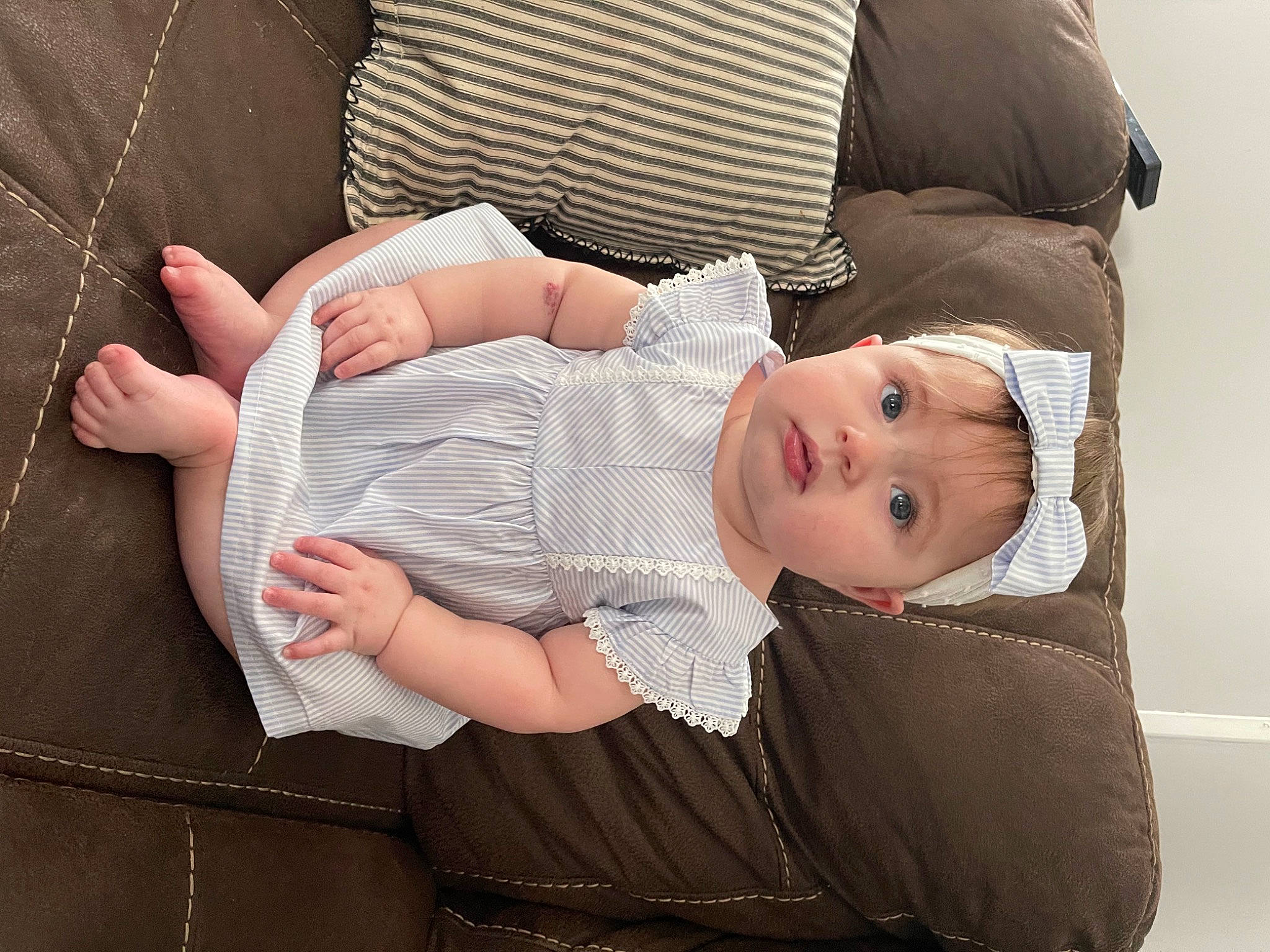 Macy Lacole Miracle is registered to the contest to win money with this photo: baby, baby_products, baby_toddler_clothing, cheek, child, comfort, eyelash, gesture, hand, hat, headwear, linens, pattern, person, pink, sitting, skin, sleeve, smile, textile