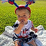baby, child, outdoor, grass, blanket, headband, beads, patriotic, red_white_blue, sunlight, cute, sitting, playing, portrait, summer, festive, star, accessory, clothing, nature