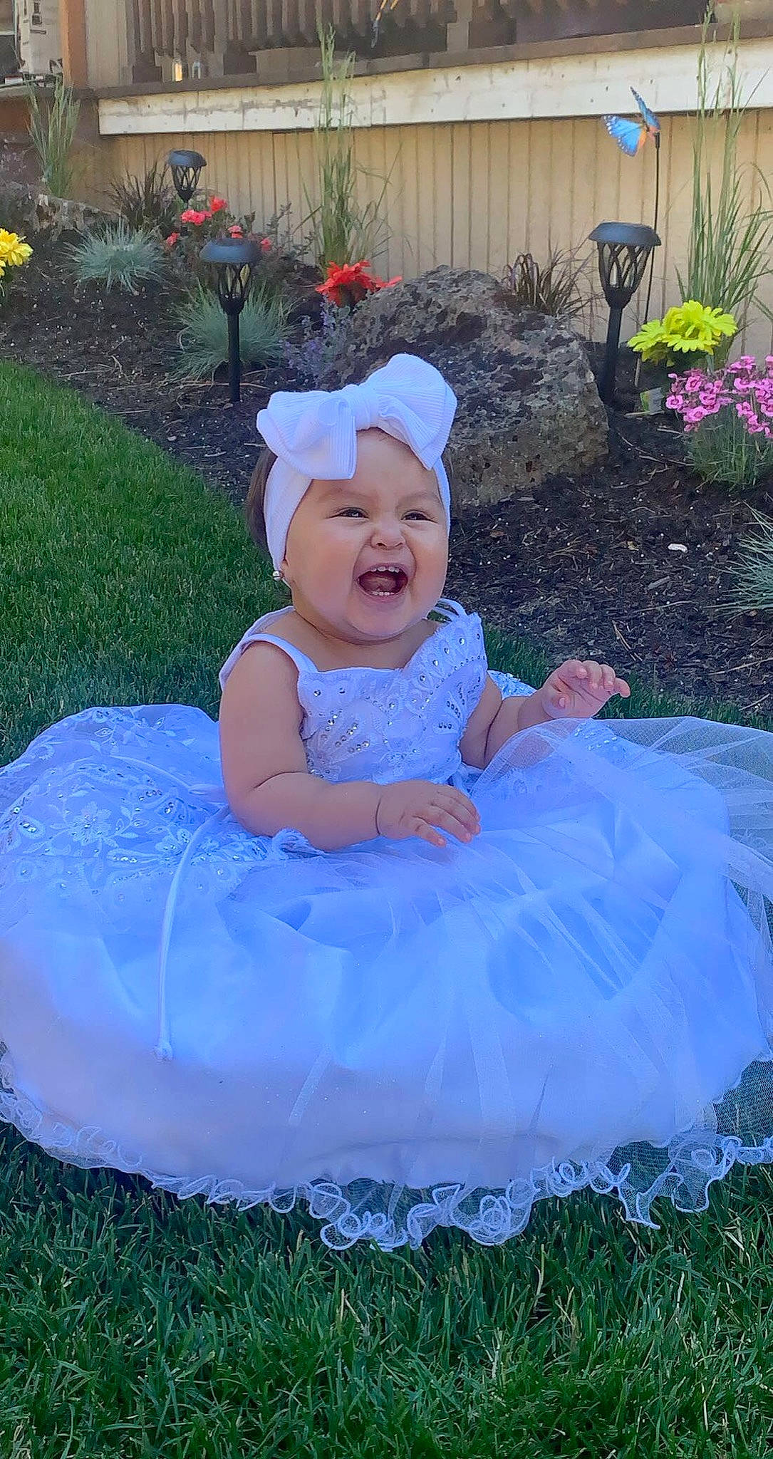 Karen is registered to the contest to win money with this photo: baby_toddler_clothing, beauty, child, dress, electric_blue, event, flower, fun, grass, green, happy, hat, headwear, lawn, person, pink, plant, product, purple, smile