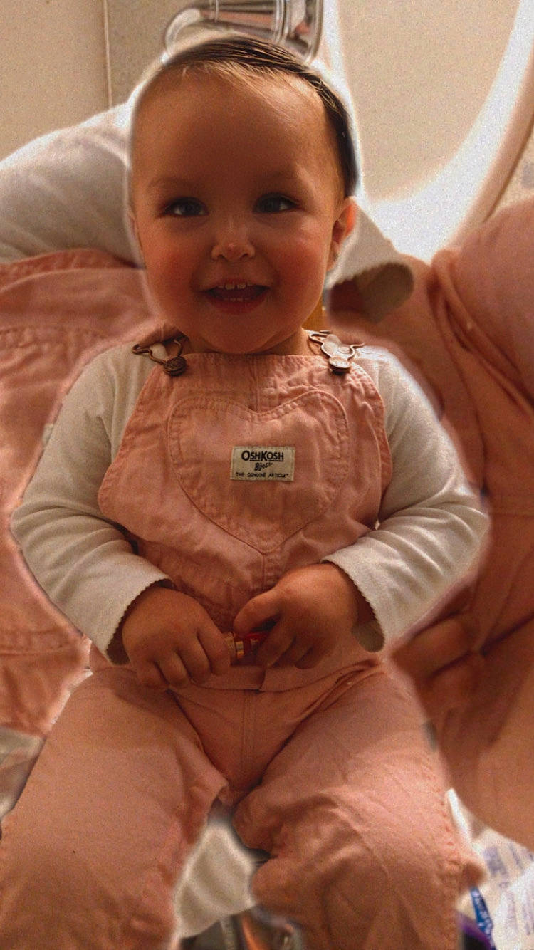 Karen is registered to the contest to win money with this photo: baby_toddler_clothing, cheek, chin, comfort, eye, face, hair, hairstyle, head, human_body, iris, joy, lip, mouth, neck, nose, outerwear, person, skin, sleeve