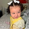 Amelia Guerrero joined the competition — help win amazing prizes! toddler, child, curly_hair, white_bows, yellow_outfit, pooh_patch, bed, bedding, patterned_sheets, smile, indoor, cute, person, infant, young_child, playful, portrait, happy, clothing, baby