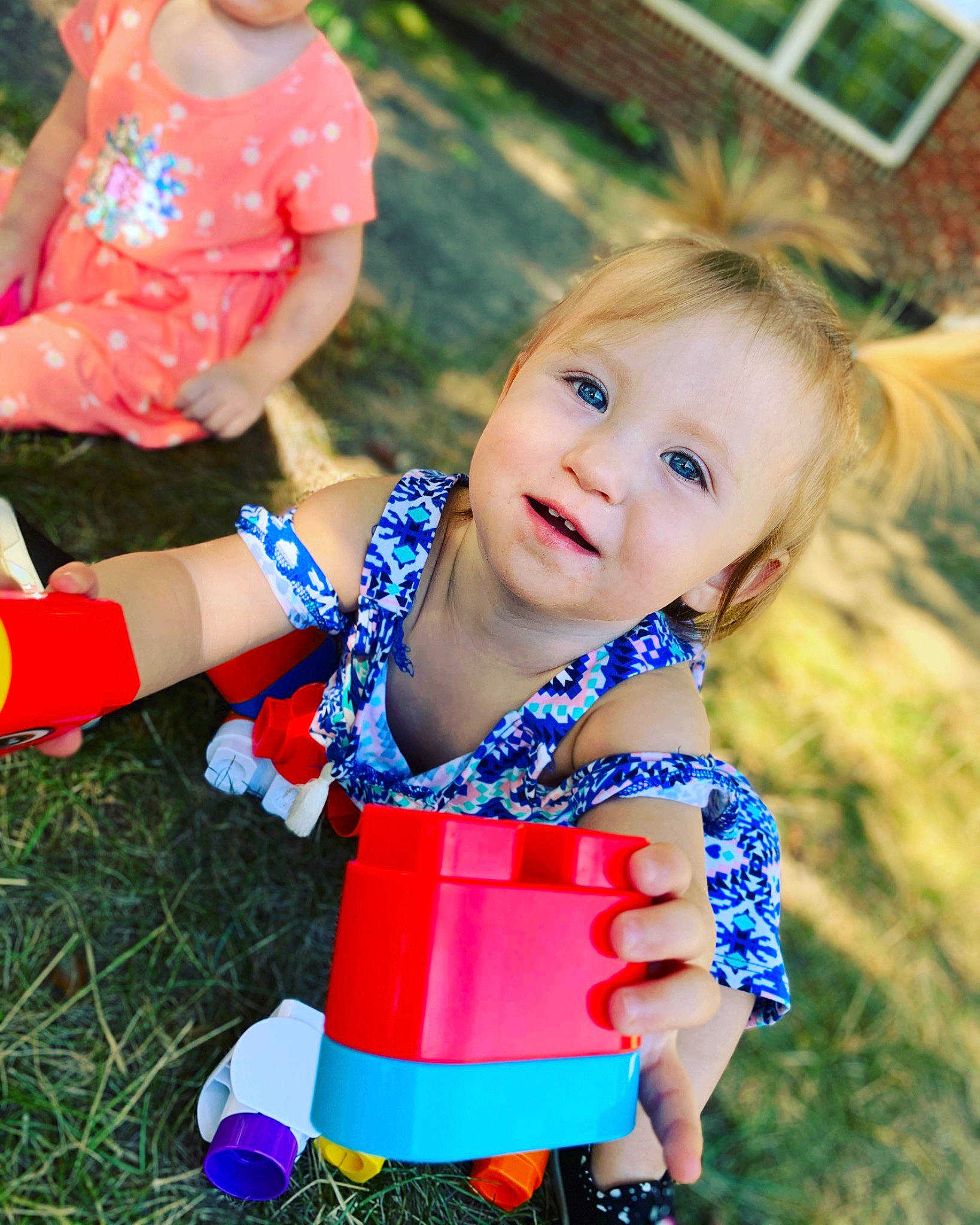 Serenity is registered to the contest to win money with this photo: arm, baby, baby_grabbing_for_something, baby_toddler_clothing, child, overall, people_in_nature, person, plastic, play, playing_with_kids, sock, summer, toddler, watering_can, yard